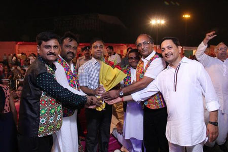 Members exchanging greetings at a Rajasthan Association evening